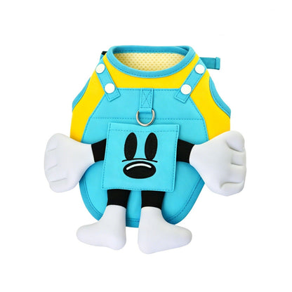 Blue and yellow dog harness with cartoon face design on a white background